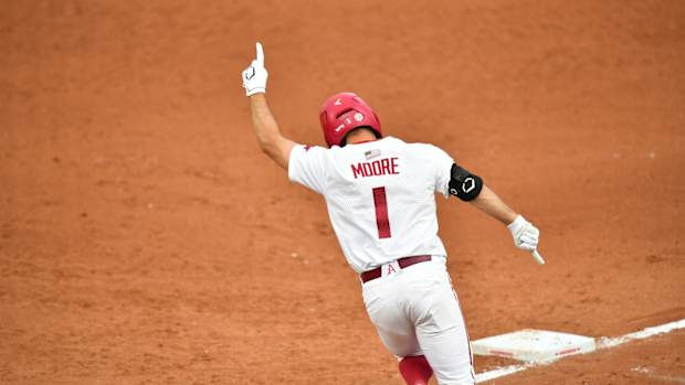 Arkansas' Robert Moore celebrates his game-tying home run (2)